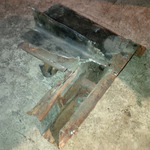 Old torque box removed--notice the rusted frame side and overlapped replaced metal on top left